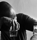 African American man drinking alcohol