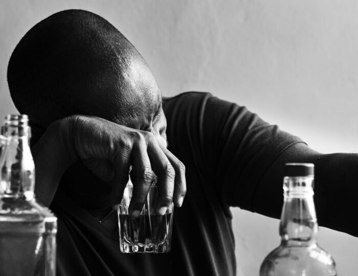 African American man drinking alcohol African American man drinking alcohol